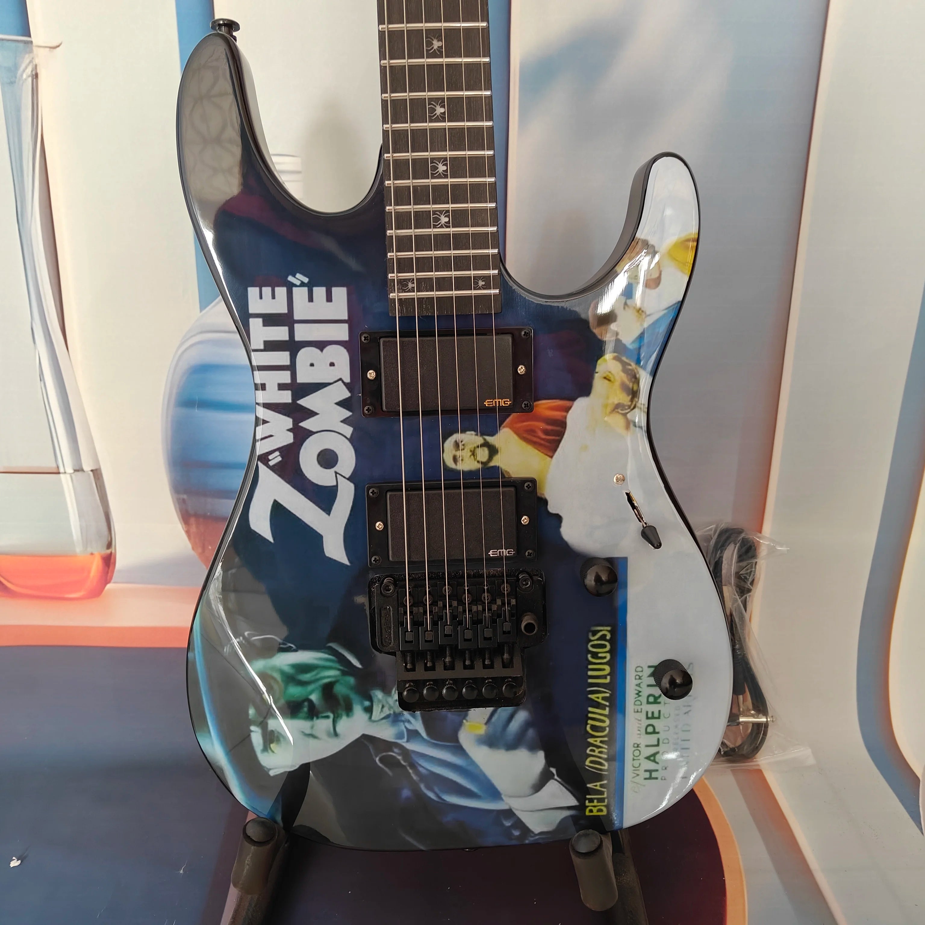A high-quality acoustic electric guitar with solid wood body, body decals, rock style, right-hand playing and stainless steel fr